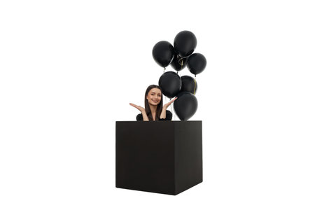Woman joyfully poses with balloons on Black Friday, isolated, PNGの写真素材