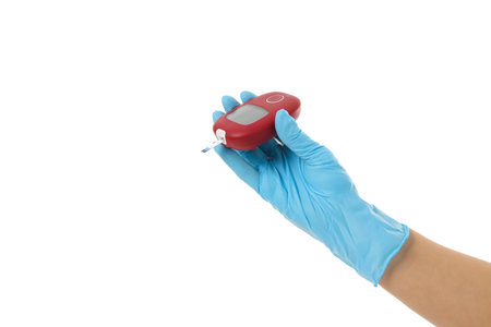Blue-gloved person measures blood glucose, isolated on white, PNG