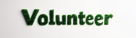 Text made of green grass forming the word volunteer, created with AIの写真素材