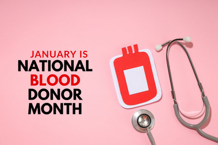 Text promoting National Blood Donor Month with a stethoscopeの写真素材