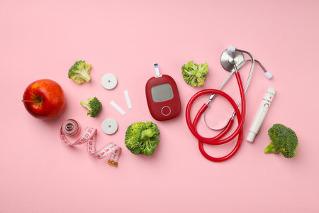 Medical gear and healthy foods on a pink backdropの写真素材