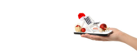 Hand holding a small Christmas chair, isolated, PNGの写真素材