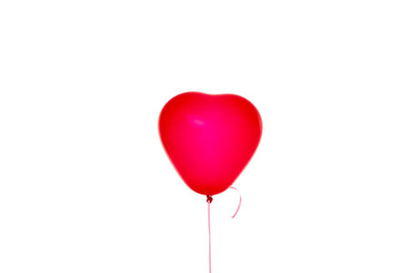 Red heart balloon against a white background, isolated, PNGの写真素材