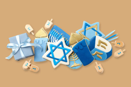 Decorative Hanukkah cookies and dreidels with gifts displayedの写真素材