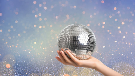 Hand holding disco ball with sparkling lights, created by AI