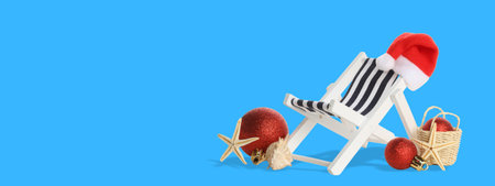 A Christmas beach chair against a blue backdropの写真素材