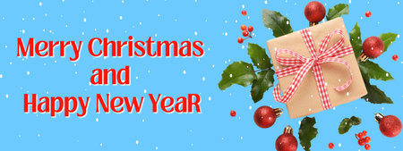 Festive holiday message with decorations on a blue backgroundの写真素材