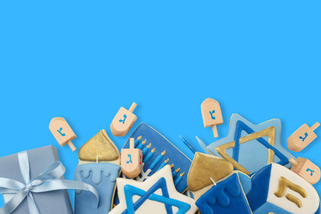 Decorative hanukkah cookies and dreidels on blue backgroundの写真素材