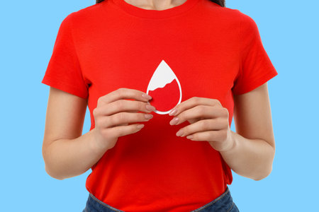 Blood donation: person with blood drop iconの写真素材