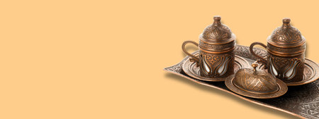 Traditional copper coffee set displayed elegantly for Ramadanの写真素材