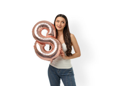 Celebrating Women's Day with a young woman and balloon, isolated, PNG