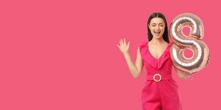 Young woman stands with a balloon in shape of eight