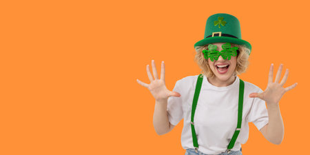 Woman in green hat and glasses shows excitement for holiday