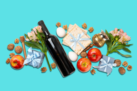 Passover items are arranged with flowers, wine, and matzah