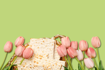 Matzah is arranged with pink tulips for Passover festivities