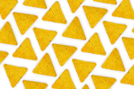 Nachos Mexican chips pattern on white background. Tortilla crisps nachos snack wallpaper, top view....