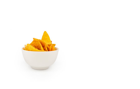 Tortillas in a white ceramic bowl on a white background with copy spaseの写真素材