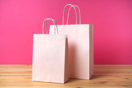 Clean paper pink packets on a bright pink background. Doasting ecology and uranial shopping.の写真素材