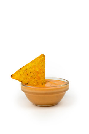 Cheese sauce with crispy nachos with place for text.の写真素材
