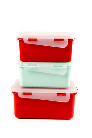 Vertical photo. Plastic lunch boxes isolated on white background, side viewの写真素材