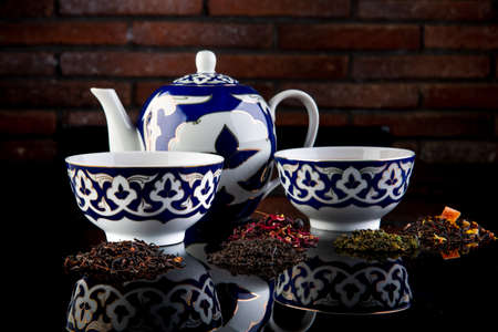 tea on a black background with reflection