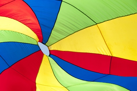 A colorful fabric with red, yellow, blue and green  stripes for background useの写真素材