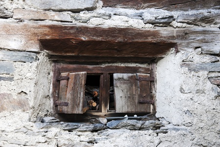 Window of a old cottage in the Alps mountainsの写真素材