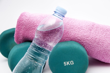 Fitness  concept - dumbbells, water bottle and towelの写真素材