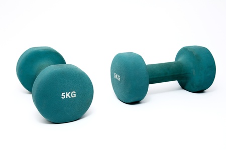 Two green  dumbbell isolated on whiteの写真素材