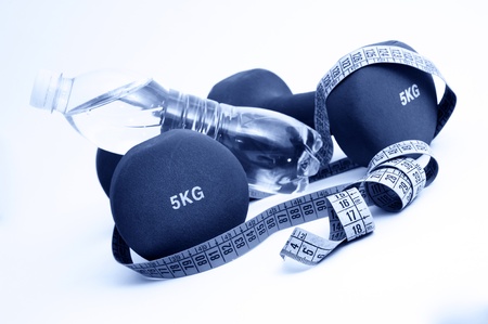 Fitness  concept - dumbbells and measure tape  Blue toneの写真素材