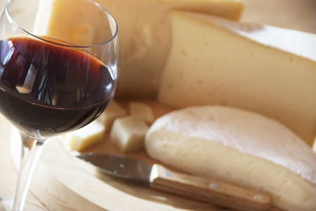 A red glass of wine and italian cheeseの写真素材