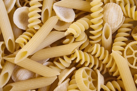 Different kinds of Italian pasta as food background or texture close