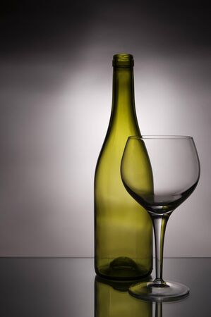 Empty glass and wine bottleの写真素材