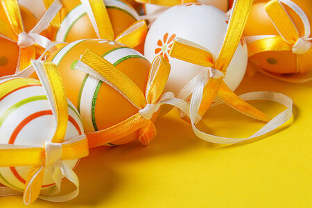 Painted Easter eggs on a yellow backgroundの写真素材
