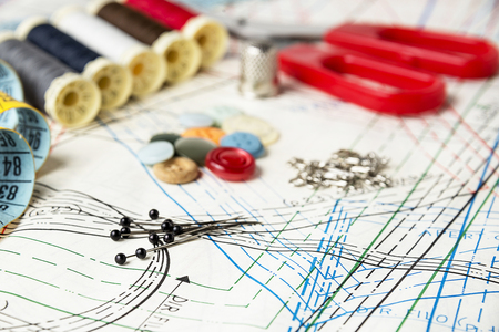 Accessory of the tailor  pins,  thread,  buttons,  tape, thimble and pattern