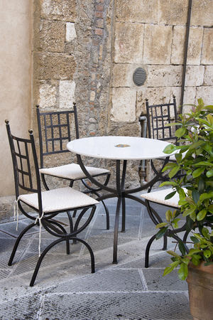 Old outdoor cafe in a traditional tuscany street - Italyの写真素材