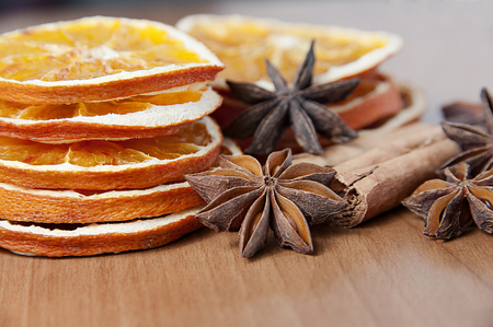 Spices decoration - anise stars, orange slices, cinamon sticksの写真素材