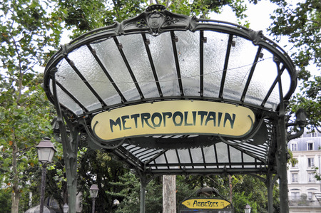 PARIS, FRANCE - 20 August 2014: The entrance to the Abbesses station for the Paris Metro. Famous art nouveau built in 1912 and one of only two remaining with a glass canopy supported by an ornate metal structure.のeditorial素材