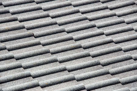 Background of grey tiles pattern on traditional roofの写真素材