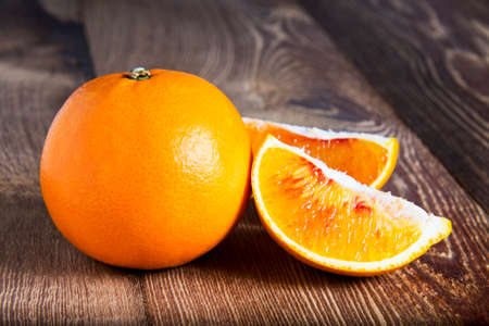 Oranges on a wooden tableの写真素材