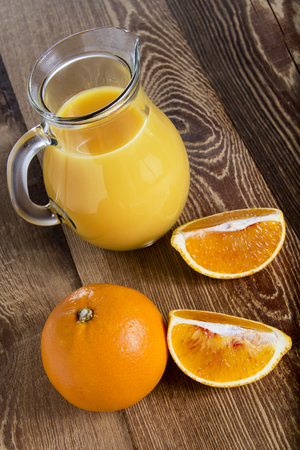 Orange juice on a wooden tableの写真素材