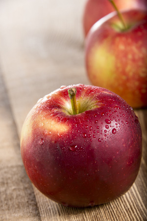 Fresh Red Apples on the wooden tableの写真素材