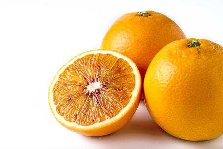 Two and half oranges on white backgroundの写真素材