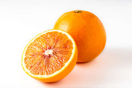 One and half oranges on white backgroundの写真素材