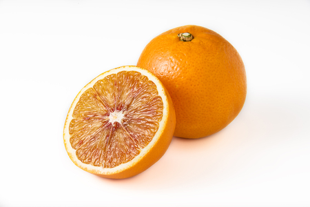 One and half oranges on white backgroundの写真素材