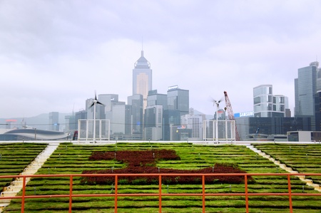 Mar 23, 2012 - Tsim Sha Tsui, Kowloon Island, Hong Kong. Beautiful green field with Hong Kong building viewのeditorial素材