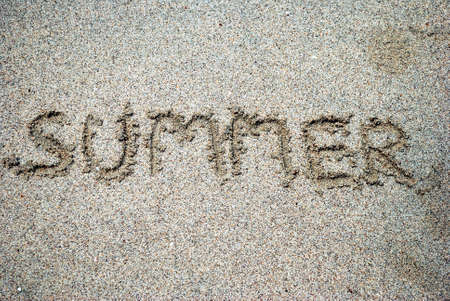 Summer handwritten on sand beachの写真素材