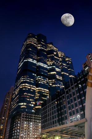Bangkok, Thailand, Sep 12, 2013 - Landscape building in the night scene with moon at Sathorn intersection, Bangkok, Thailandのeditorial素材