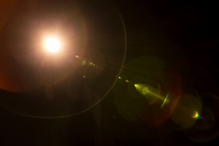 Lomography camera lens flare on a black backgroundの写真素材
