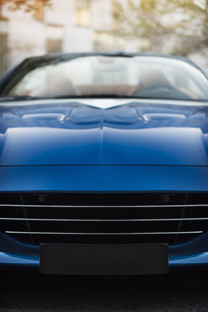 Detail of a dark blue racing sport car with bonnet scoop vent on body chasis and front coolerの写真素材